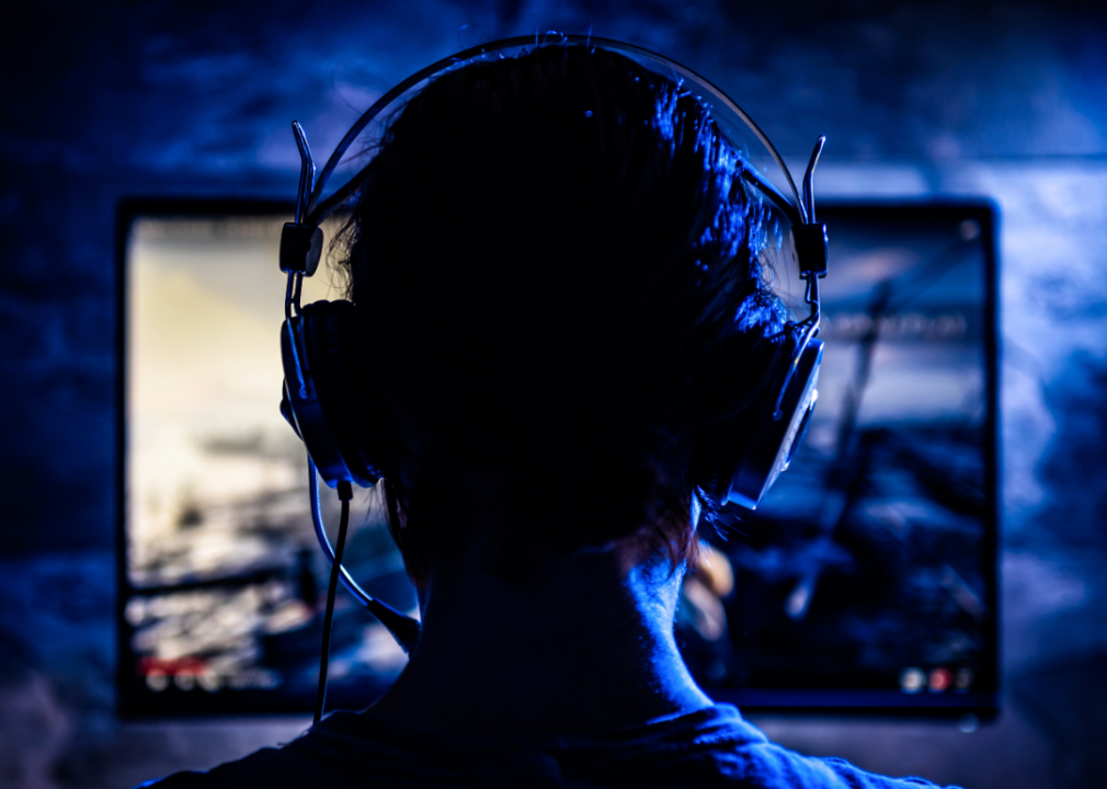 A person gaming in the dark