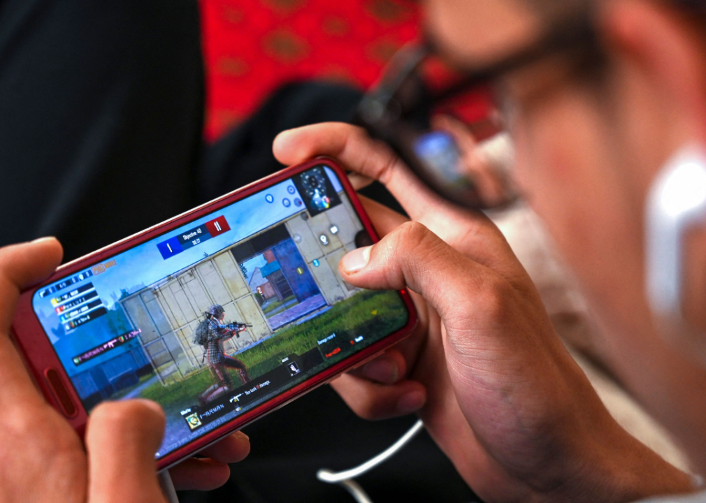 A person playing a handheld game