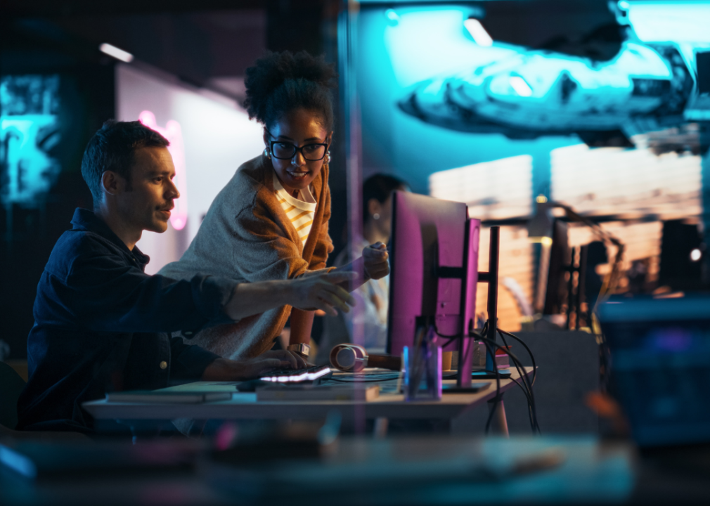 Two people working on a video game